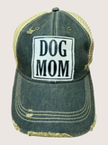 Black and gold cap with 'DOG MOM' text on a light gray background