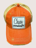 Orange cap with 'Chaos coordinator' patch on a light gray background