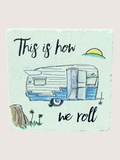 coaster with Illustration of a camper with text 'This is how we roll' on a light blue background