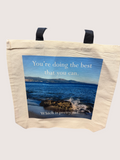 Tote bag with scenic design and motivational quote on a white background