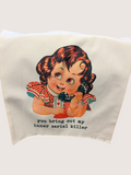 Vintage-style tote bag with illustration of a girl and humorous text on a plain background