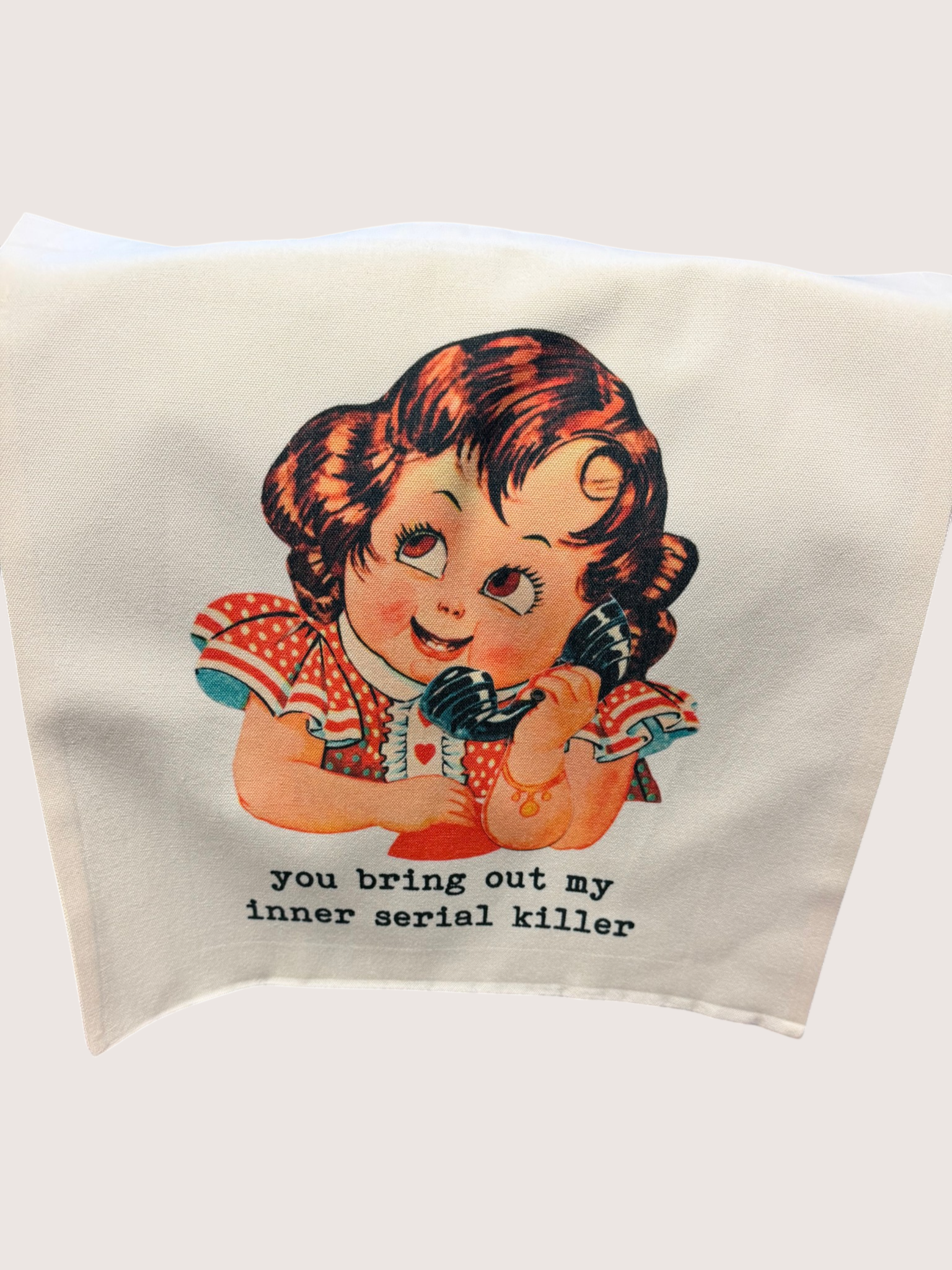Vintage-style tote bag with illustration of a girl and humorous text on a plain background