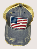 Denim cap with American flag patch on a light gray background