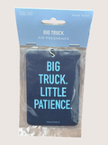 Air freshener with 'BIG TRUCK. LITTLE PATIENCE.' text on a clear background