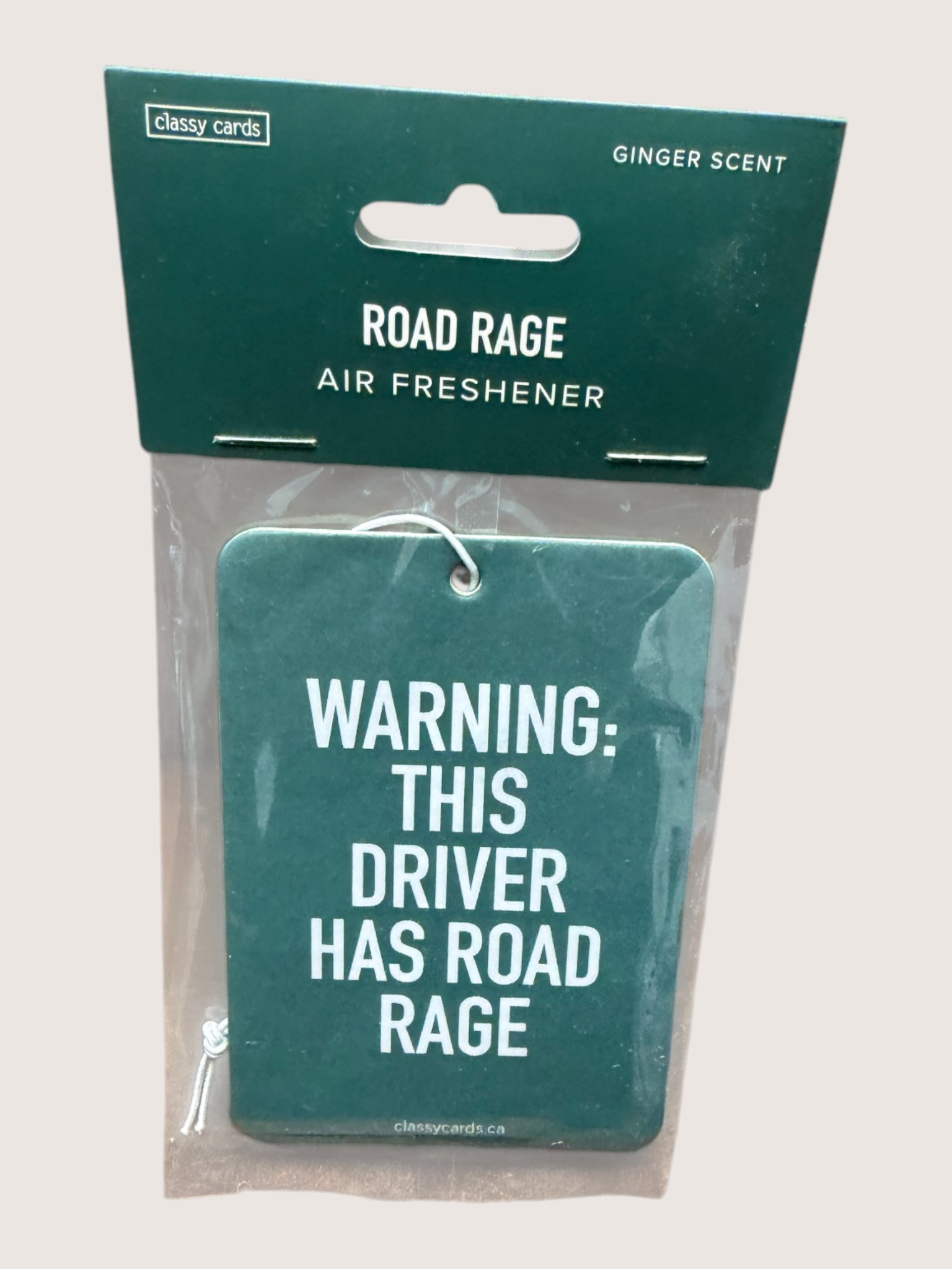 Road Rage air freshener packaging with text on a white background