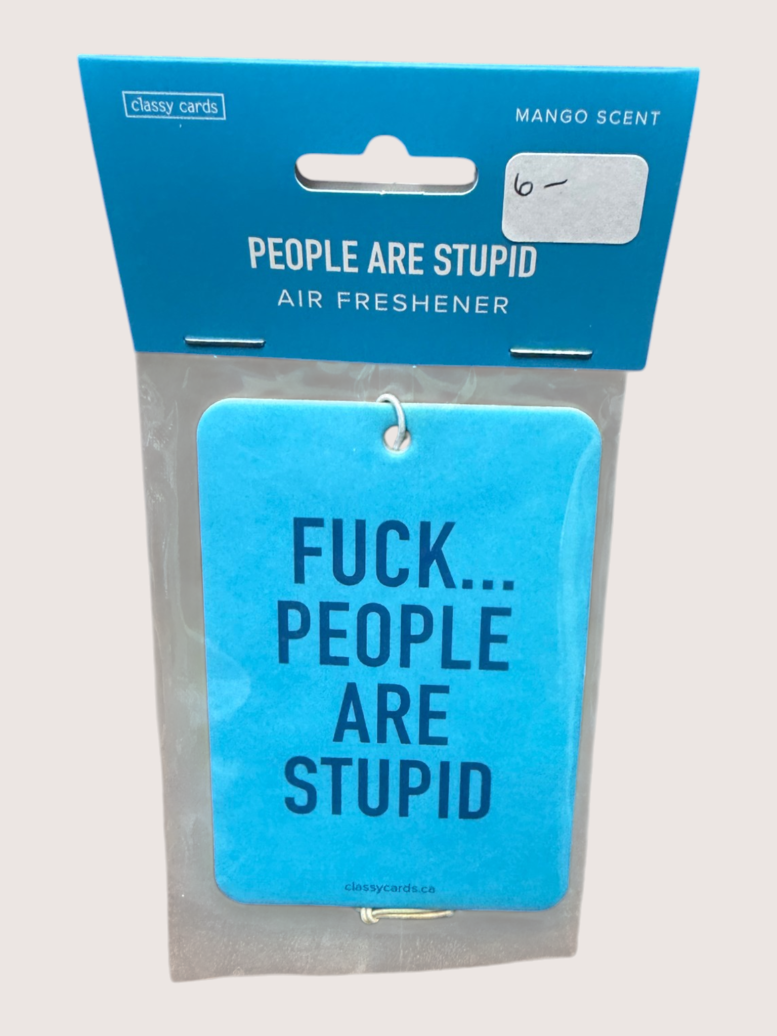 Blue air freshener with text and packaging on a light gray background