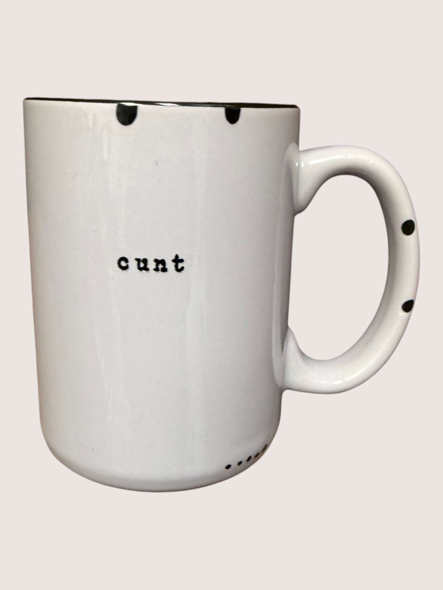 White mug with black text on a white background