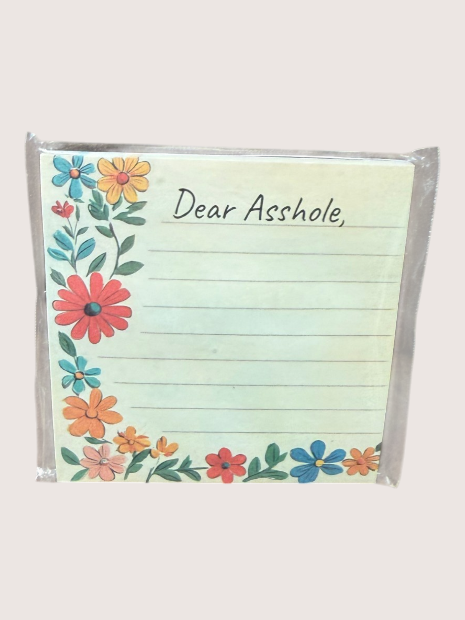Floral notepad with 'Dear Asshole' text on a white background