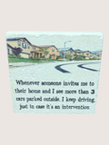 coaster with Text on a road scene with houses and a streetlight, featuring a humorous quote.