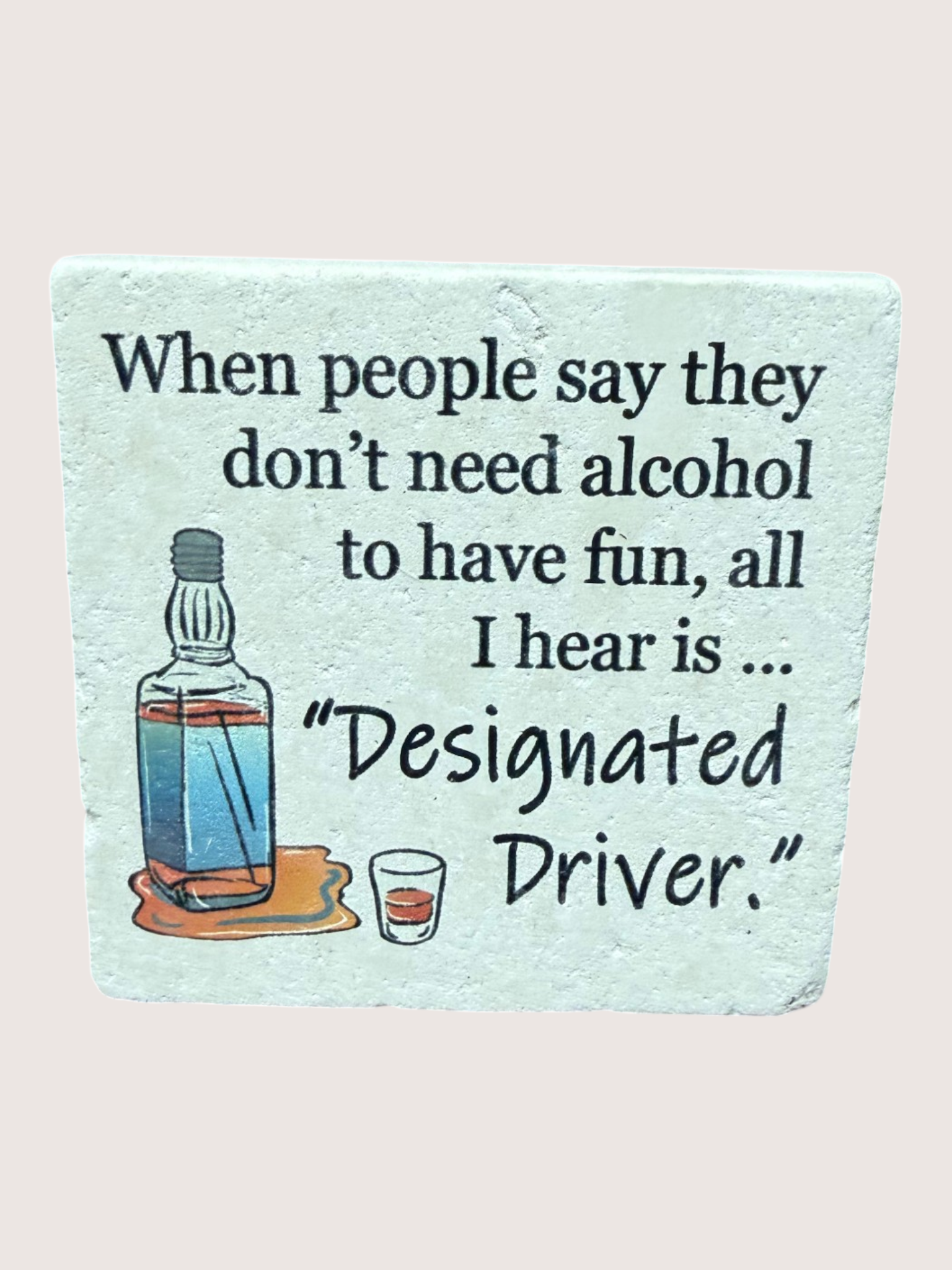 Coaster with humorous quote about alcohol and designated drivers on a light blue background