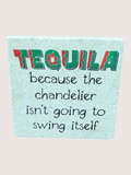 Teal coaster with colorful 'Tequila' text and humorous message on a light gray background