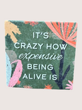 coaster Floral design with text 'It's crazy how expensive being alive is' on a green background