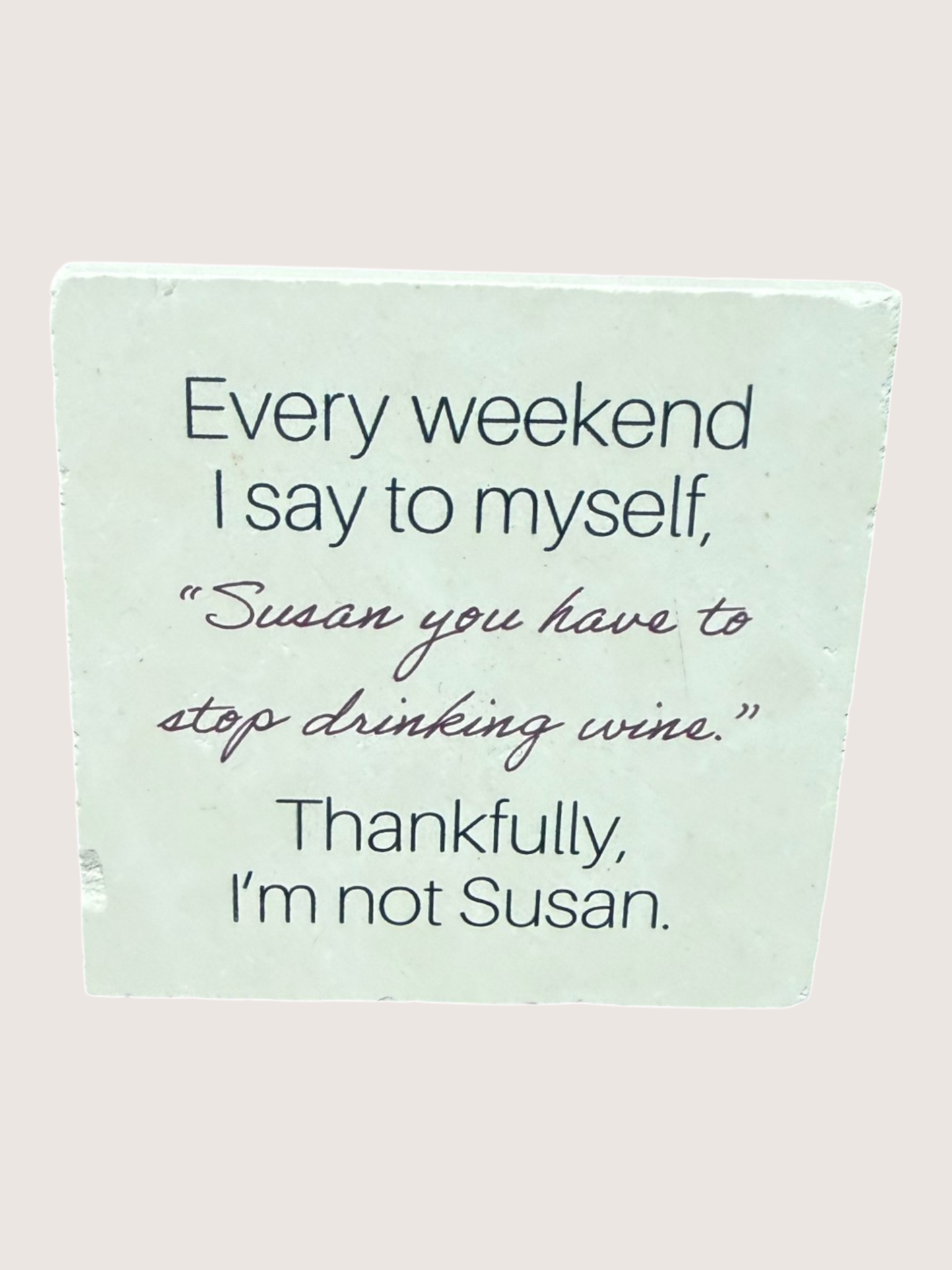 coaster Text on a light green background with a pink background