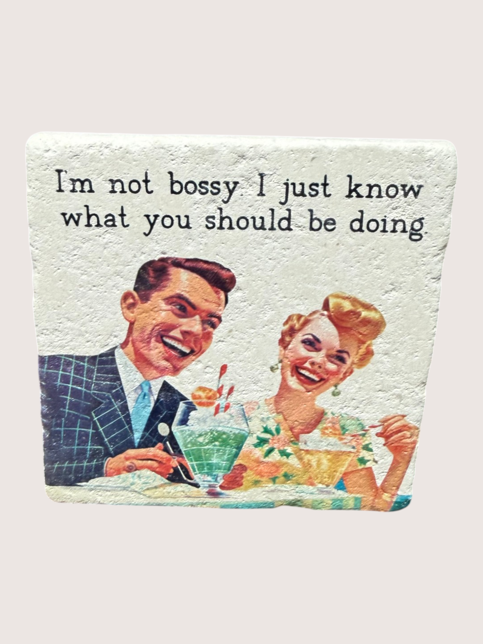 Vintage-style coaster illustration of a man and woman with text 'I'm not bossy I just know what you should be doing'.