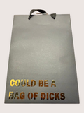black gift bag with gold text on a white background