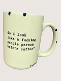 Mug with text 'do i look like a fucking people person before coffee?' on a light background