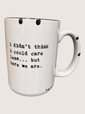 White mug with black text on a white background