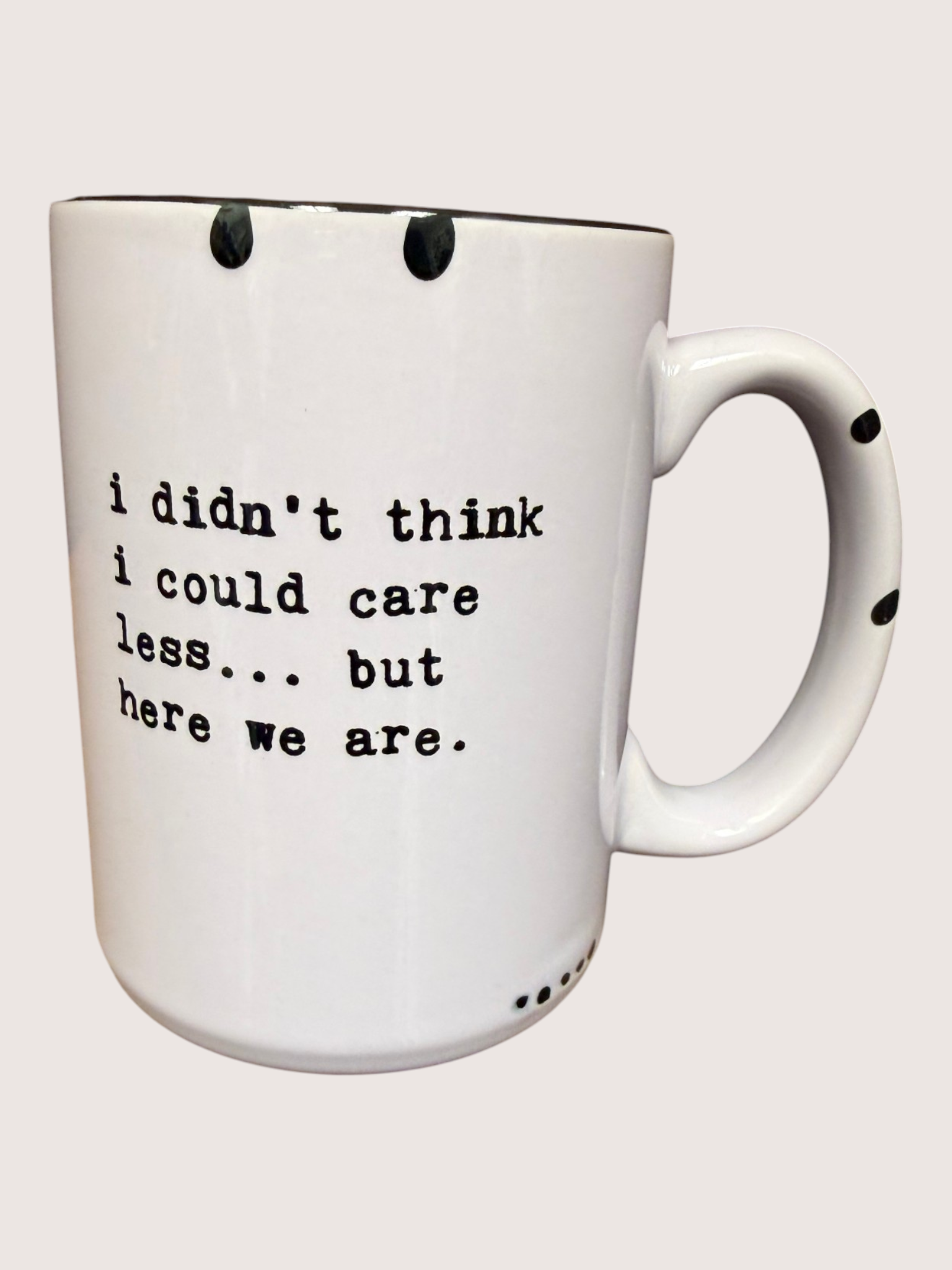 White mug with black text on a white background