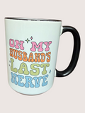 Mug with colorful text 'On my husband's last nerve' on a light background