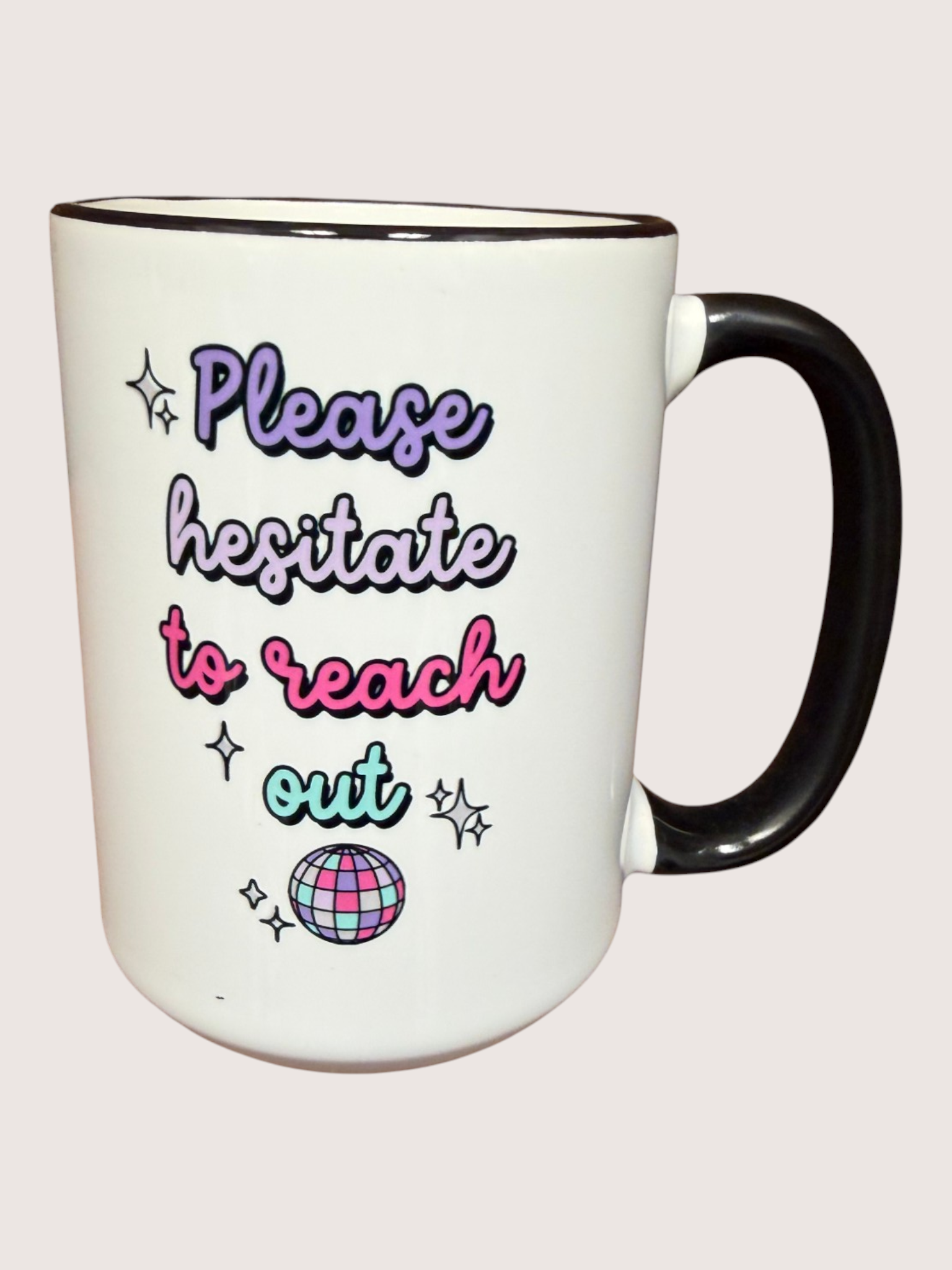 White mug with colorful text and graphics on a white background