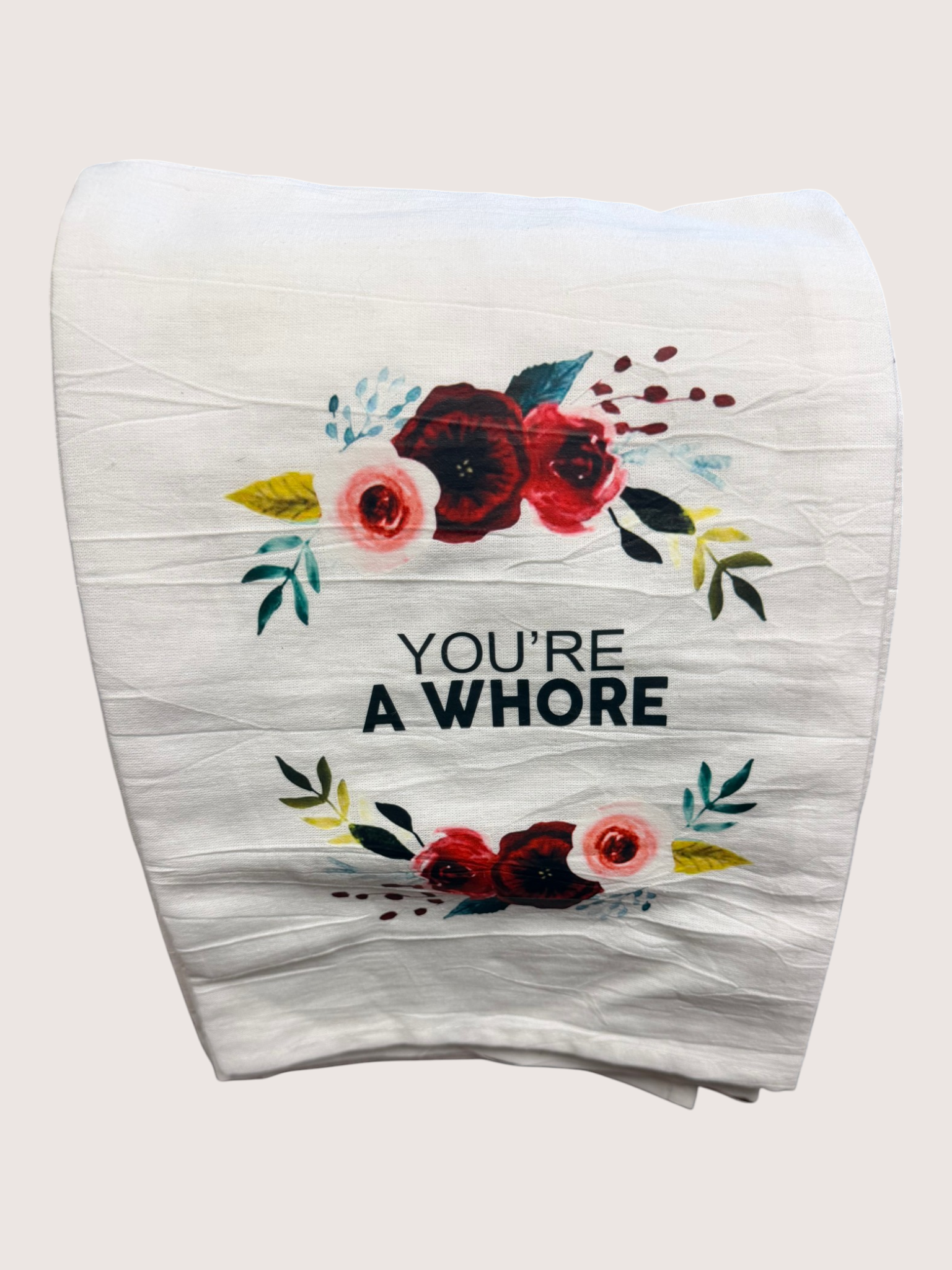 Floral design tote bag with text on a white background