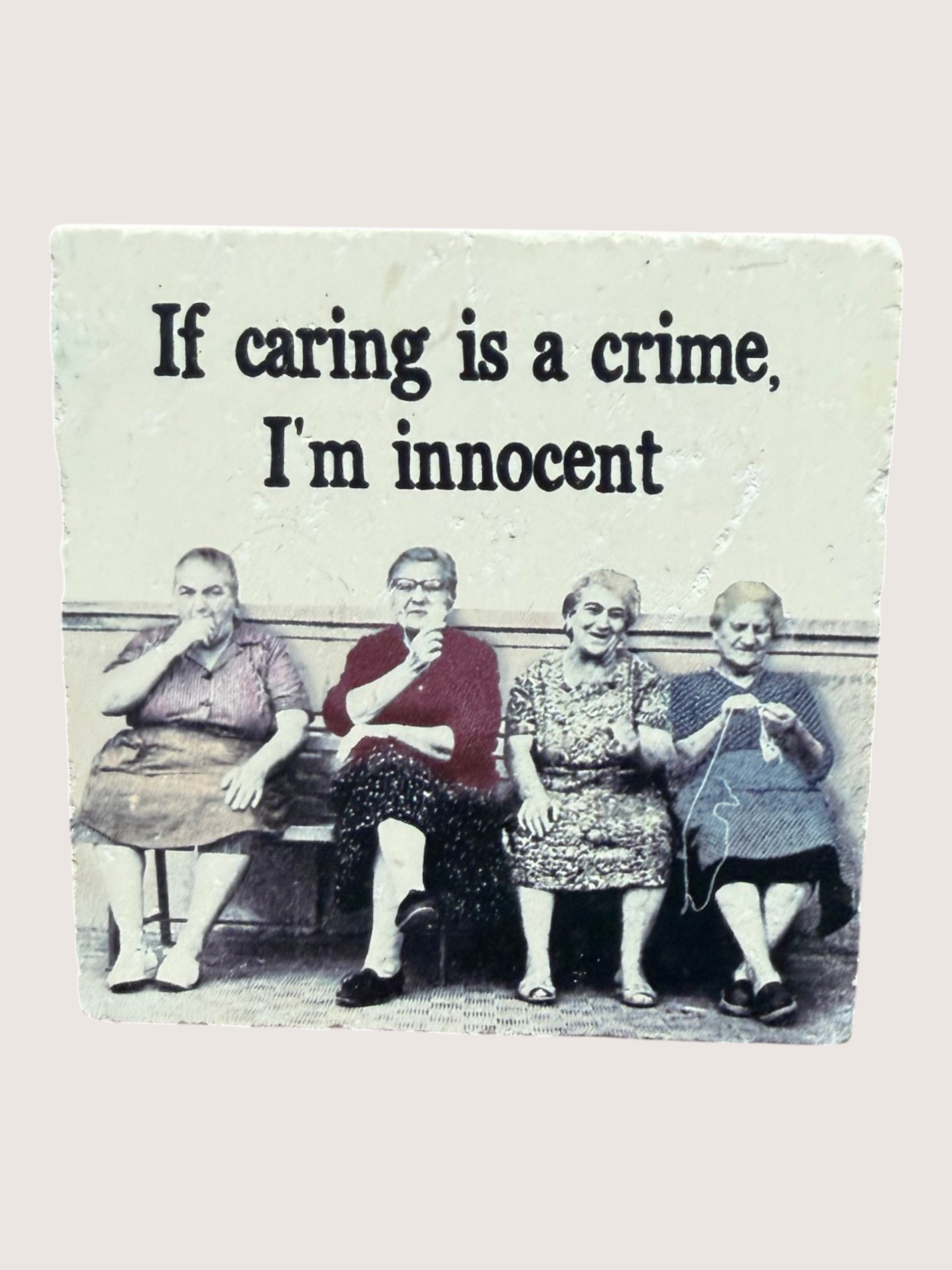 coaster with text "If caring is a crime, i'm innocent"