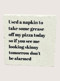 Coaster with humorous text on a light background