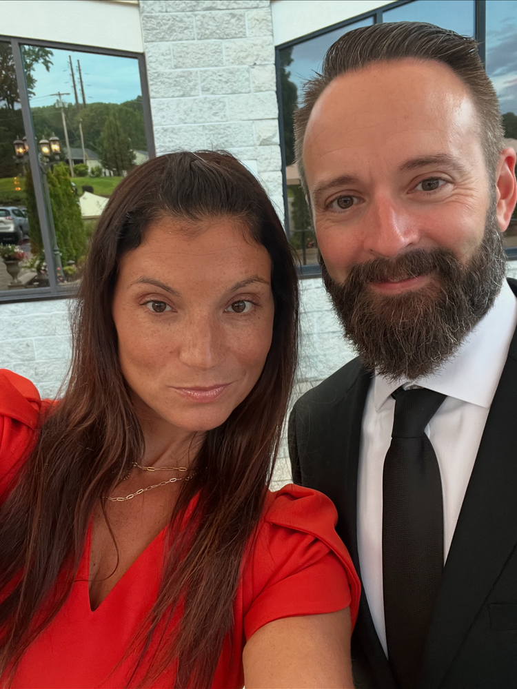 Jill and her husband dressed for an event